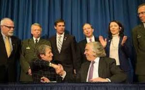 Secretary of DOI Sally Jewel and of DOE Ernie Moniz shake hands on launching the new park as a partnership between their two agencies.